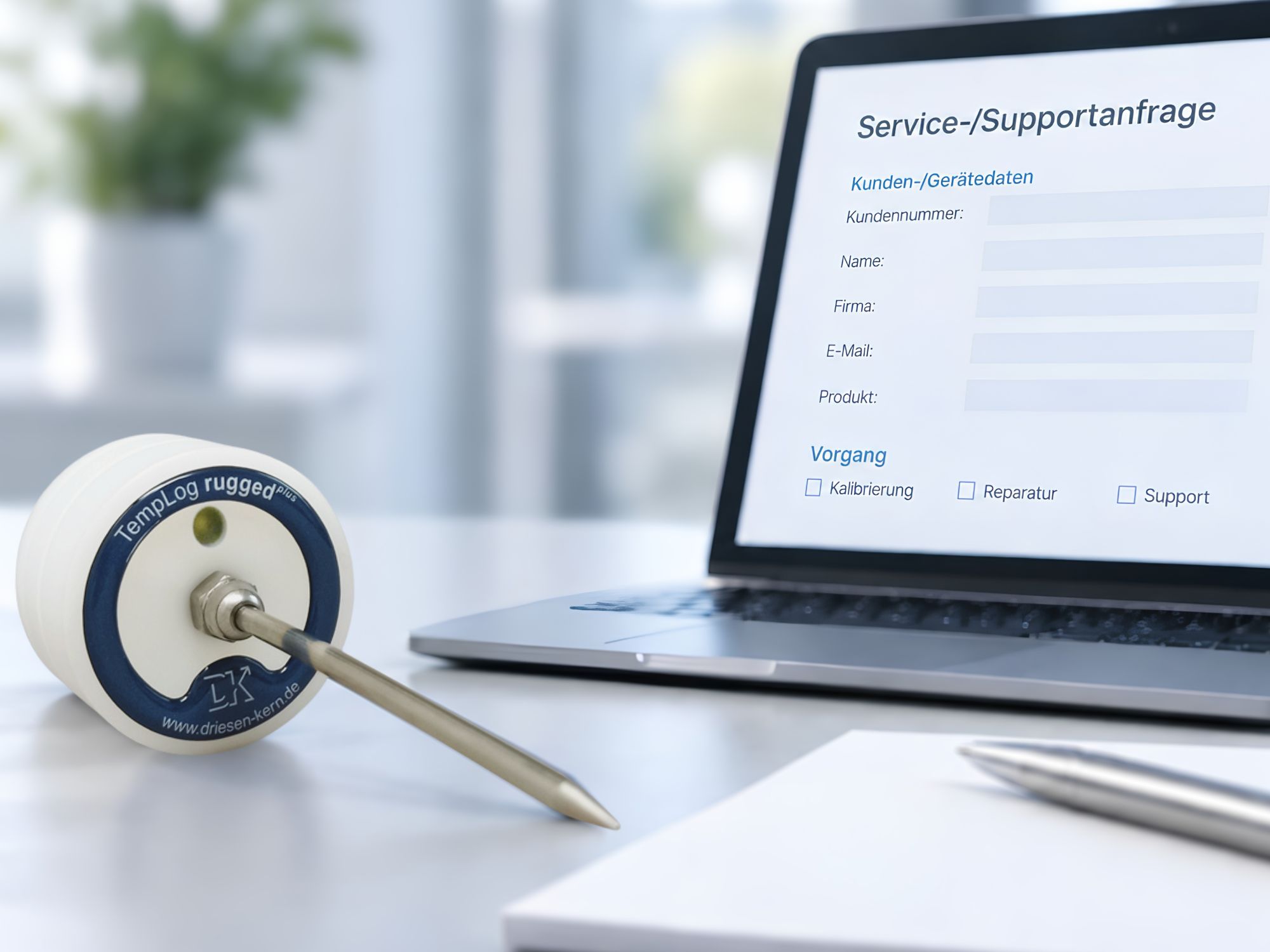 Temperatur Datenlogger on a table with service form on screen on a laptop asking for customer service